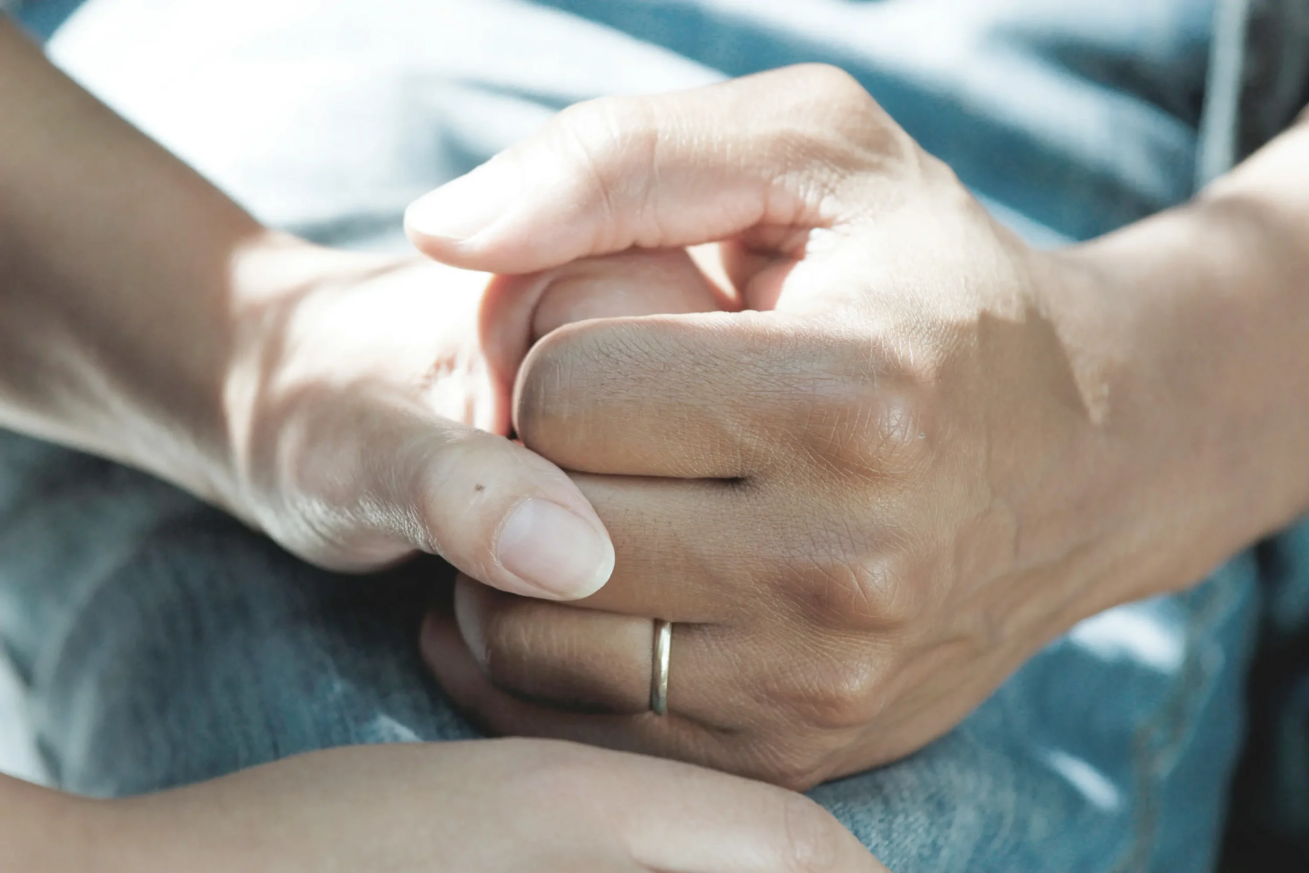 Two people holding hands